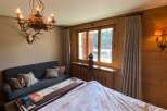 Cozy bedroom with rustic charm.
