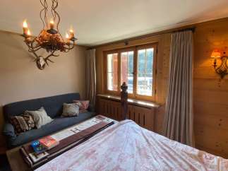 Cozy bedroom with rustic charm.