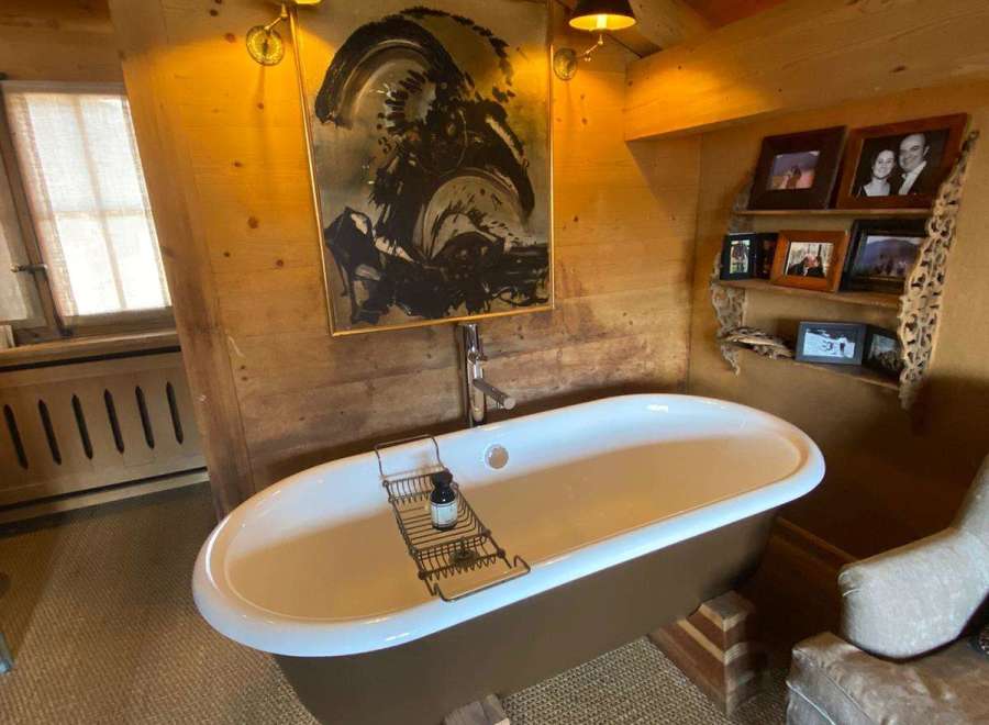 Indulge in luxury within this stunning bathroom, featuring a unique freestanding bathtub.
