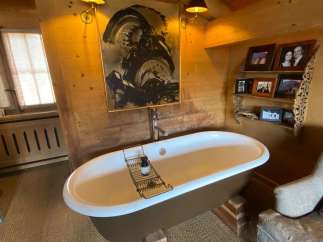 Indulge in luxury within this stunning bathroom, featuring a unique freestanding bathtub.