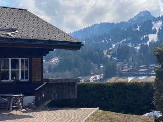 Escape to the serene beauty of this charming chalet nestled in the mountains.
