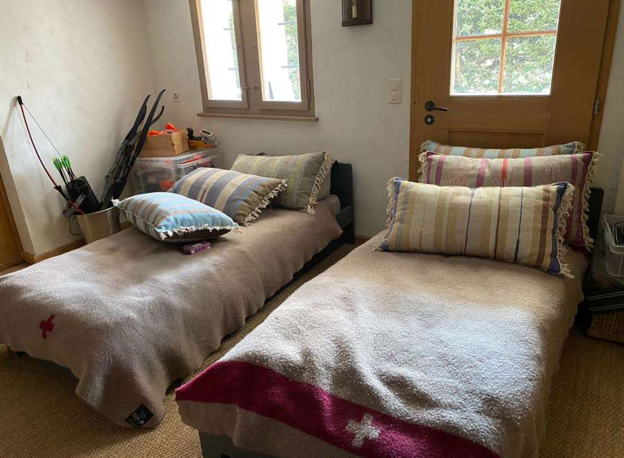 Cozy bedroom with two single beds, perfect for a guest room or a small space.