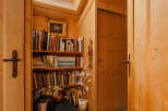 Step into a cozy reading nook bathed in natural light from a skylight.