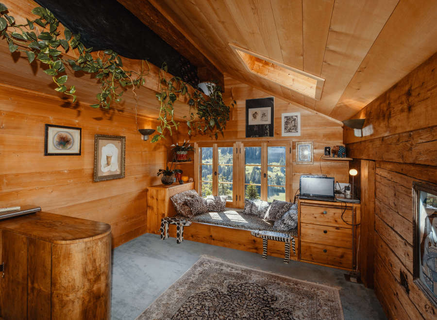 Step into a cozy cabin retreat with warm wooden interiors and a charming ambiance.