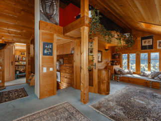 Step into a cozy wooden cabin retreat, where rustic charm meets modern comfort.