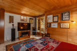 Cozy bedroom with wood paneling and a warm ambiance.