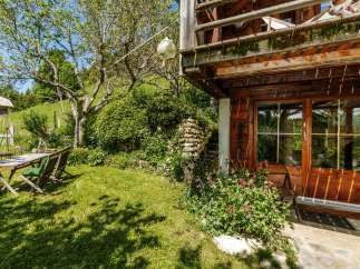 Discover the charm of this rustic cabin nestled in a serene natural setting.