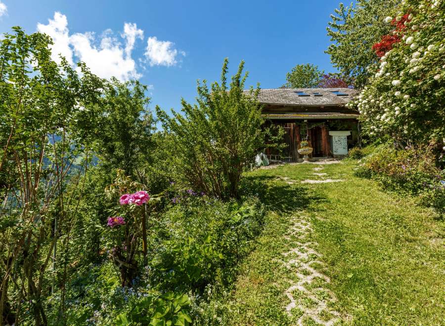 Discover a charming property nestled amidst lush greenery.