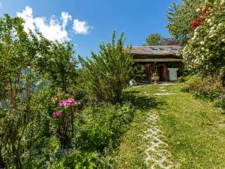 Discover a charming property nestled amidst lush greenery.