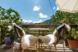 Enjoy breathtaking mountain views from this charming outdoor seating area.