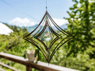This stunning outdoor decor features a unique geometric design, perfect for adding a touch of elegance to your patio or garden.