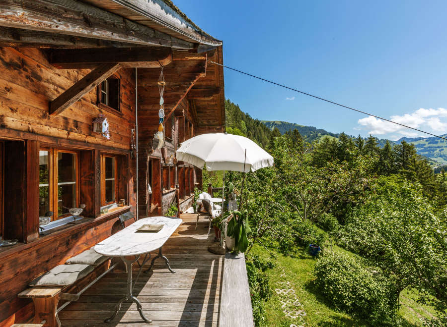 Escape to a charming wooden cabin nestled in the mountains, offering a serene retreat.