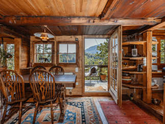 Step into a cozy cabin retreat with stunning wooden interiors and a warm, inviting atmosphere.