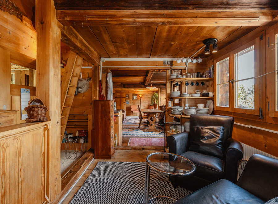 Step into a cozy, rustic retreat with this charming wooden interior.