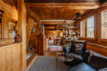 Step into a cozy, rustic retreat with this charming wooden interior.