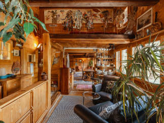 Step into a cozy, rustic haven with this inviting interior.