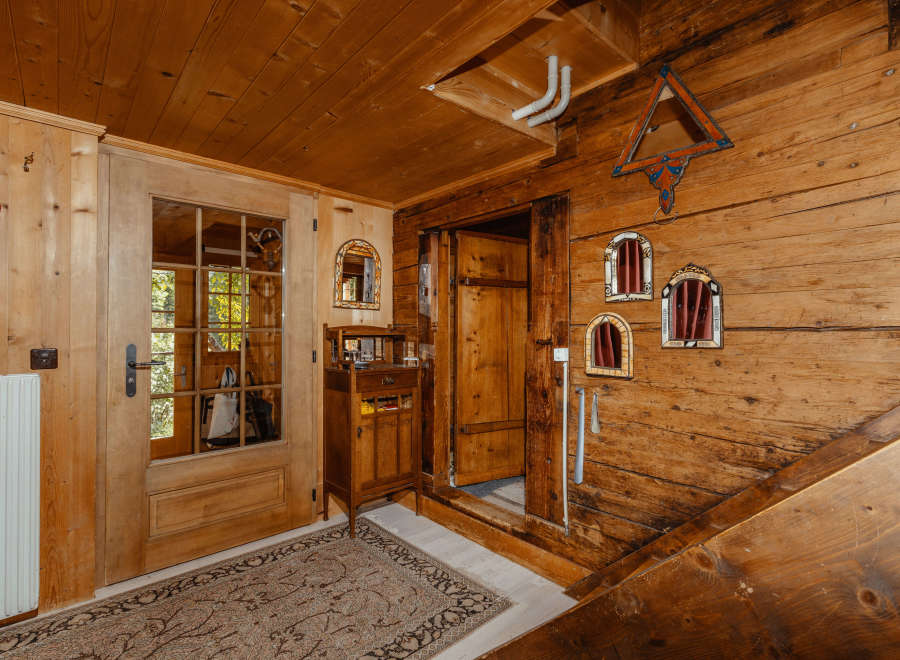Step into a rustic haven with this charming wooden interior.