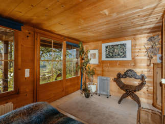 Step into a cozy cabin retreat with stunning wooden interiors.