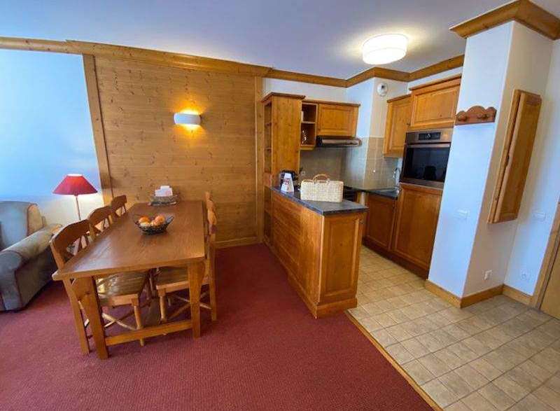 Cozy apartment with a fully equipped kitchen and a dining area perfect for enjoying meals.