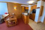 Cozy apartment with a fully equipped kitchen and a dining area perfect for enjoying meals.