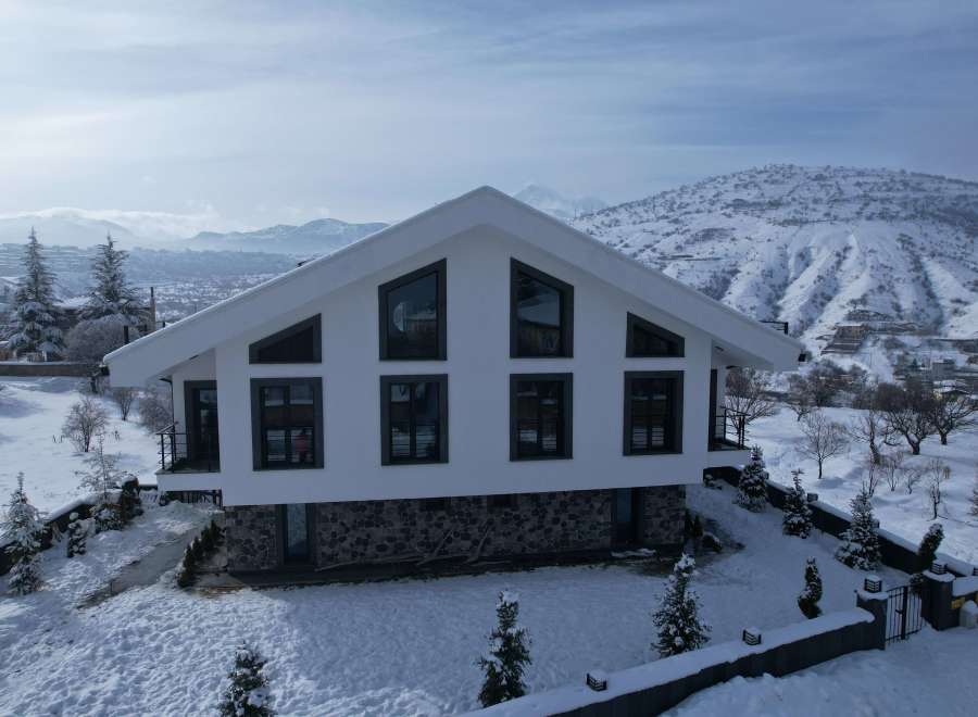 Experience the tranquility of winter in this stunning modern home.