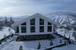 Experience the tranquility of winter in this stunning modern home.