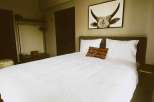 Experience comfort and style in this beautifully designed bedroom.