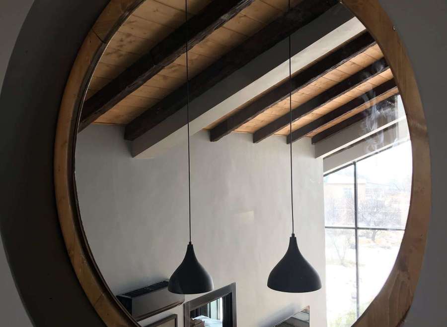 Discover the unique charm of this property, featuring a stunning circular mirror that captures the essence of the space.