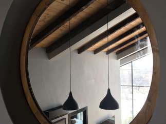 Discover the unique charm of this property, featuring a stunning circular mirror that captures the essence of the space.