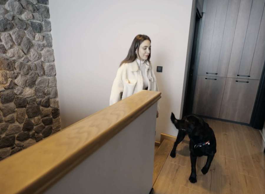 Discover a stunning property featuring a beautiful stone wall and a modern interior design.
