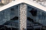 This stunning property boasts a unique architectural design with expansive glass windows, offering breathtaking views.