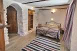 Rustic Charm Meets Modern Comfort in this Unique Bedroom.
