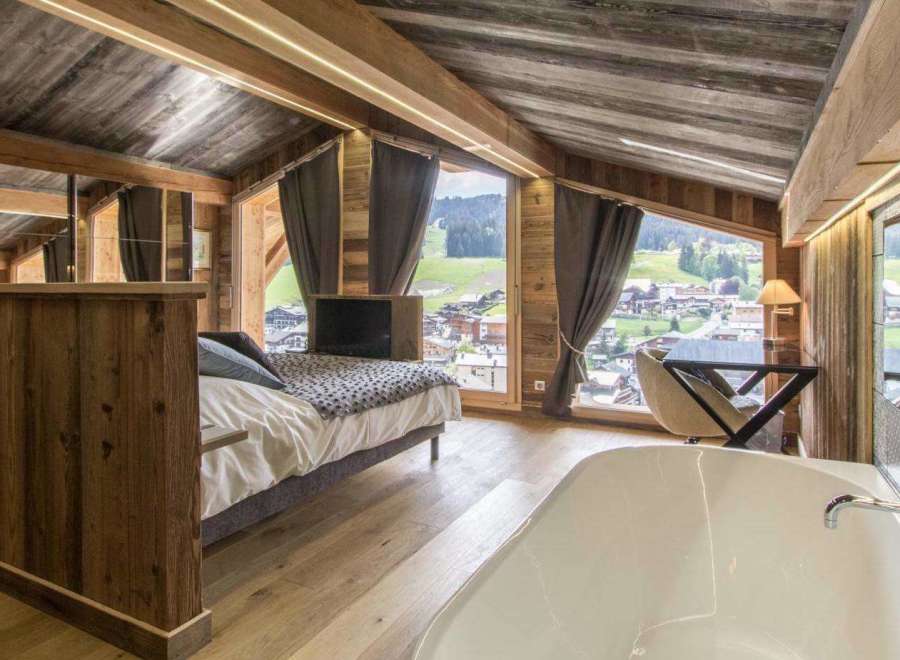 Experience luxury in this stunning chalet-style bedroom.