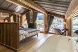 Experience luxury in this stunning chalet-style bedroom.