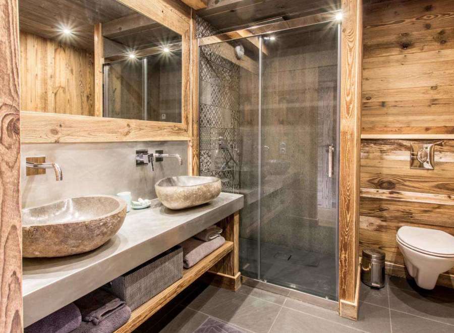 Experience rustic luxury in this stunning bathroom.
