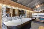 Experience rustic luxury in this stunning bathroom.