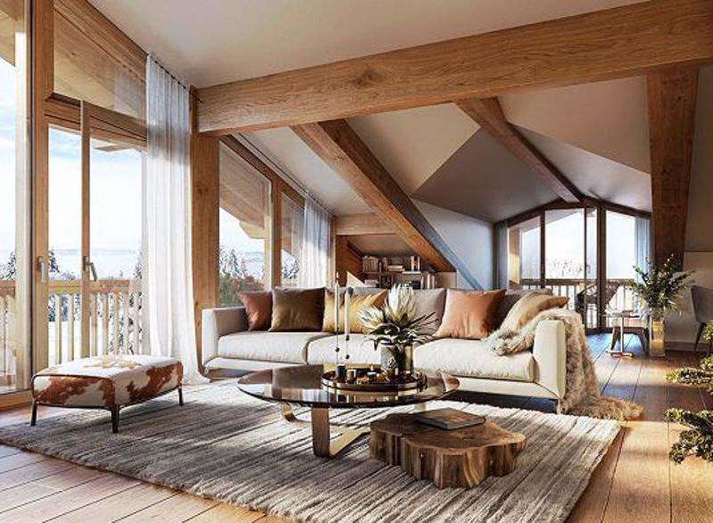 Experience luxury living in this stunning chalet-style home, boasting a bright and airy interior with exposed wooden beams and large windows.