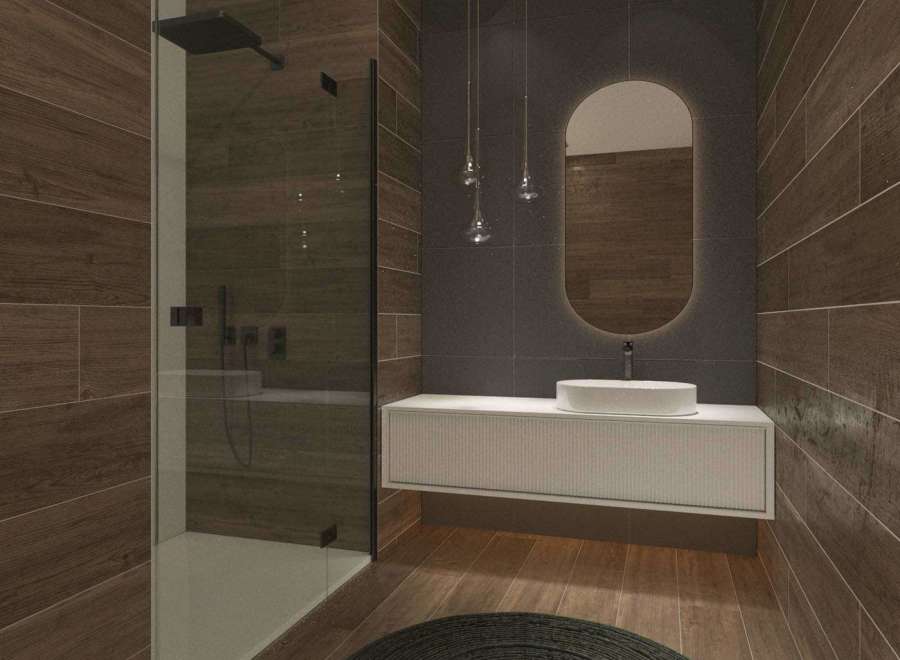 This modern bathroom features a sleek shower with glass doors and a stylish vanity.