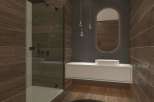 This modern bathroom features a sleek shower with glass doors and a stylish vanity.
