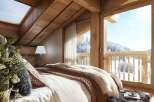 Escape to a cozy mountain retreat in this stunning bedroom.