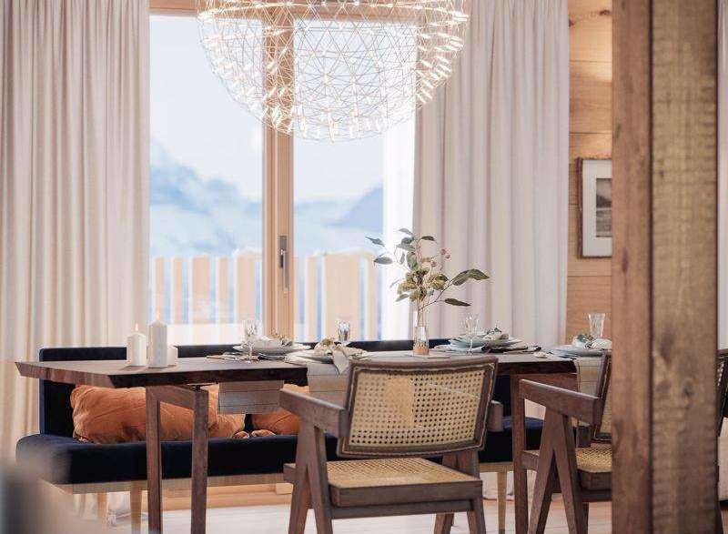 Experience the charm of this dining area, featuring a stunning spherical chandelier that illuminates the space.