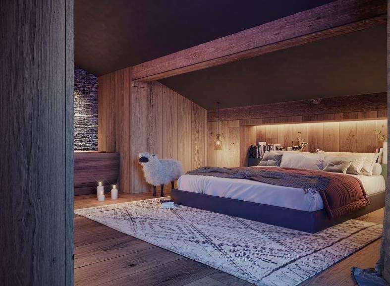 Cozy bedroom with wooden walls and a rustic rug.
