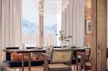 Experience the charm of this dining area, featuring a stunning spherical chandelier that illuminates the space.