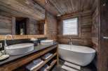 Experience rustic luxury in this stunning bathroom.