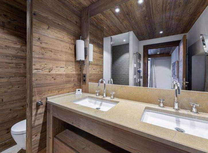 This luxurious bathroom features stunning wood paneling that adds warmth and character.