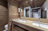 This luxurious bathroom features stunning wood paneling that adds warmth and character.