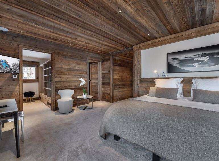 Experience rustic luxury in this stunning bedroom.