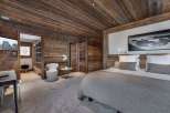 Experience rustic luxury in this stunning bedroom.