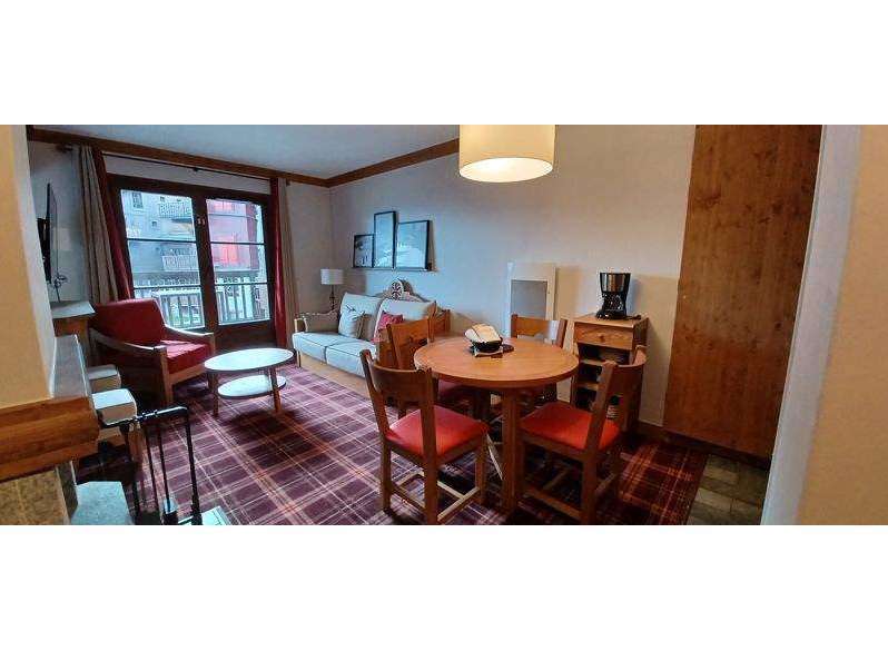Cozy living space with a charming dining area.