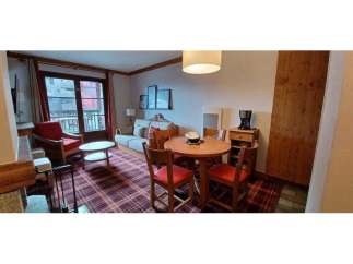Cozy living space with a charming dining area.